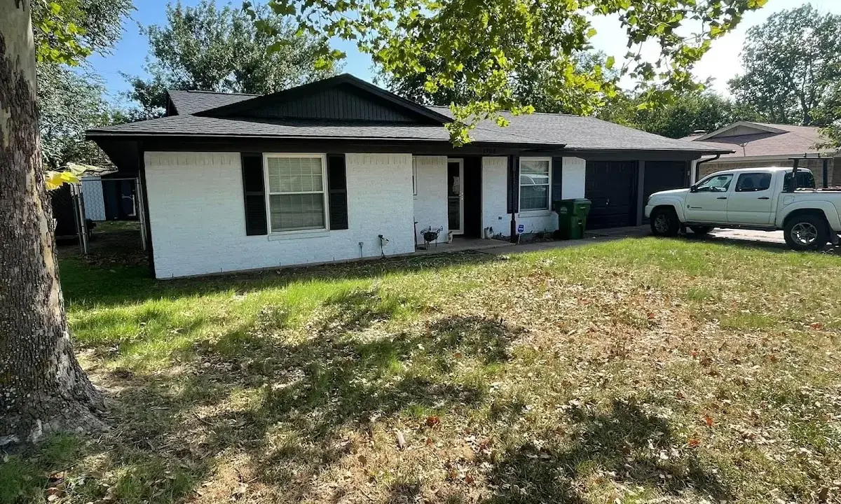 Professional roofing crew working on a residential roof in Beloit